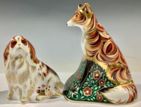 A Royal Crown Derby paperweight, Vixen, silver stopper; another, Cavalier King Charles Spaniel,