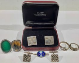 Two pairs of silver cufflinks; four silver rings; a brooch