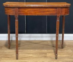 A 19th century mahogany tea table, hinged top, ring-turned legs, 74cm high, 91.5cm wide, 45cm deep