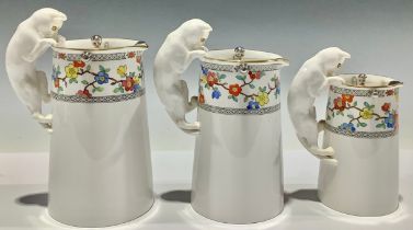 A graduating set of three Spode Copeland's China milk jugs, the handles modelled as cats, each with