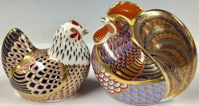 A Royal Crown Derby paperweight, Cockerel, gold stopper; another, Chicken, gold stopper (2)