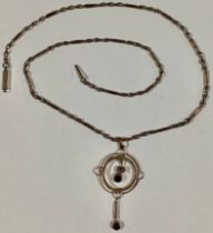 An Edwardian 9ct gold pendant necklace, set with garnets and seed pearls, 6.4g gross