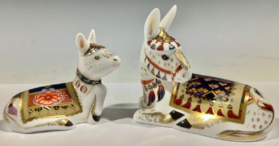 A pair of Royal Crown Derby paperweights, Donkey and Foal, silver stoppers