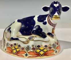 A Royal Crown Derby paperweight, Friesian Cow "Buttercup", 21st anniversary gold stopper