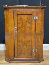 An 18th century walnut wall hanging corner cupboard