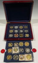 A boxed collection of British coin replicas; two Jersey £5 coins