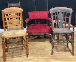 A late Victorian/Edwardian mahogany club armchair; a pair of cane dining chairs, a ladder back