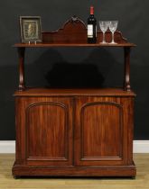 A Victorian mahogany serving buffet, shaped cresting, pierced and carved end supports, the base with