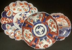 A large Japanese Imari petal edge plate; a butterfly Imari and another