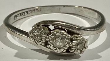 A three stone diamond ring, set in platinum white gold shank, 2.2g