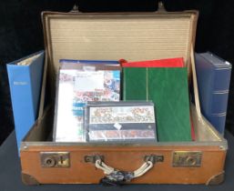 Stamps - a quantity of stamp albums and binders, FDC, etc, thousands of stamps in two suitcases