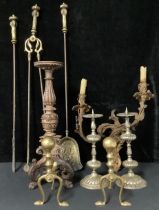 An early 20th century French ormolu wall sconce; a pair of pricket candlesticks; a set of fire