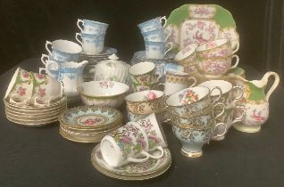 A Mintons part tea service, comprising cake plate, side plates, cups and saucers, etc; an