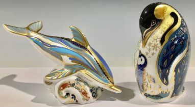 A Royal Crown Derby paperweight, Penguin and Chick, silver stopper; another, Dolphin, silver stopper