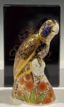 A Royal Crown Derby paperweight, Bronze Winged Parrot, gold stopper, boxed