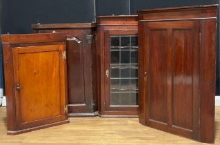 A George III oak corner cupboard, raised and fielded panel door, 99cm high; others (4)