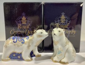 A Royal Crown Derby paperweight, Polar Bear Cub Standing, gold stopper, boxed; another, Polar Bear