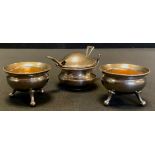 A silver mustard pot, Birmingham 1918; pair of silver plated cauldron salts (3)