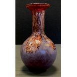 A Scottish Monart type art glass vase, stylized with encapsulated dark reds, purples and mottled
