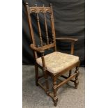 An Ercol ‘Old Colonial’ model high-back armchair.