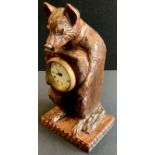 A Novelty black forest type timepiece carved as a bear, mechanical movement, 29cm high