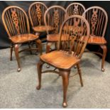 A set of six Bevan Funnell stained oak and beech Windsor type chairs, spindle and wheel splat backs,