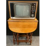 A Vintage Sony Trinitron television / TV, solid state colour, 30cm screen; drop leaf oak