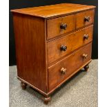 A Victorian mahogany chest of drawers, two short over two long drawers, turned handles and feet,