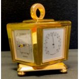 A mid century Guardier eight-day brass revolving desk-clock weather station, the sides with clock,