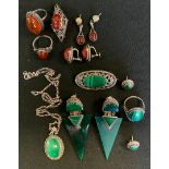 A silver and malachite pendant, similar brooch, pendant and earrings; others amber coloured etc