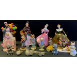 Doulton figures - Biddy Penny farthing, HN1265; The Orange Lady, HN1759; Camelia, HN222;