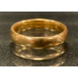 An 18ct gold wedding band, size P, 6.2g gross