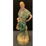 A Royal Dux figure, The water carrier, stamped no 1074, pink triangle mark, 50cm high.