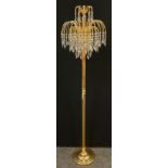 A contemporary chandelier-top standard lamp, reeded brass upright, circular base 160cm high.