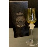 A Rosenthal Versace wine glass, yellow glass bowl, frosted Medusa-head stem, 21cm high, boxed