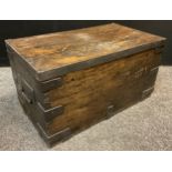 A late 19th / early 20th century metal-bound hard wood secure chest, strap iron work to lid edge and