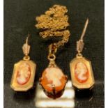 A 9ct gold mounted Cameo pendant and pair of earrings, 3.6g gross (faults)