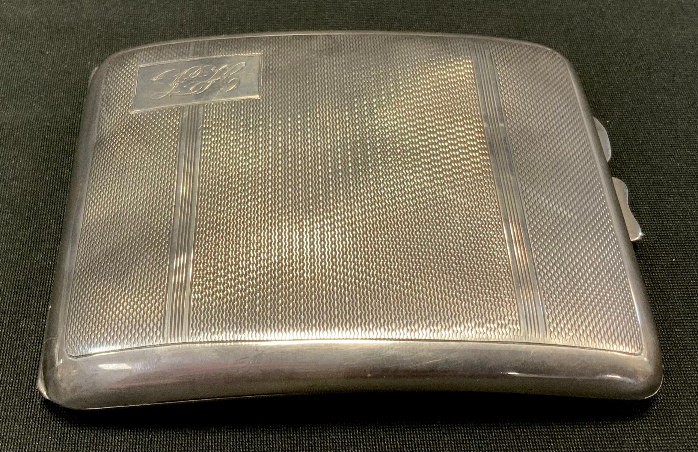 A silver cigarette case, Birmingham 1936, 141.3g
