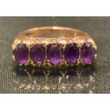 A 9ct gold amethyst five stone ring, 6.8g gross