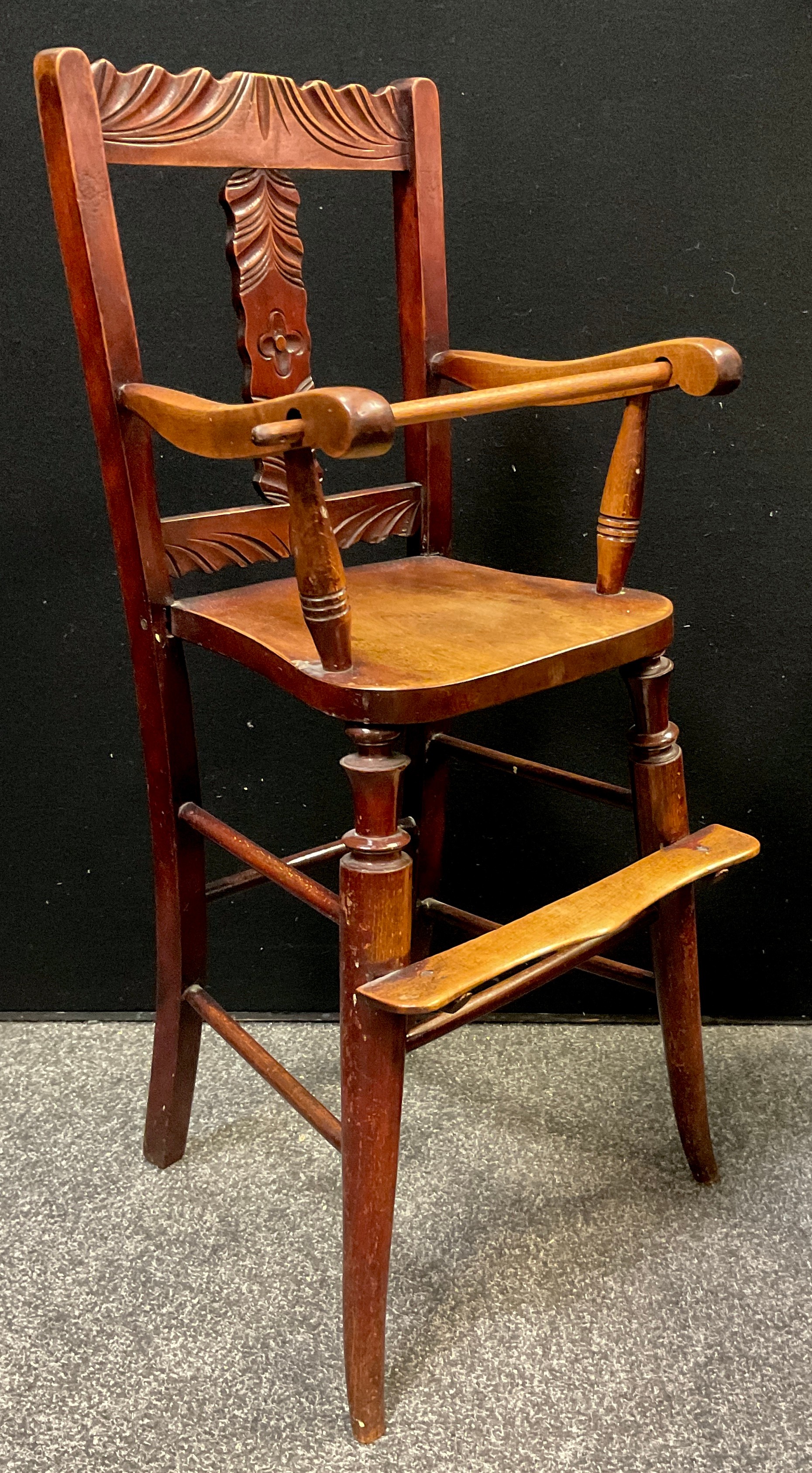 A Victorian Child’s walnut high-chair, 87.5cm high, c.1890.