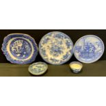 A 19th century willow pattern tea bowl and saucer; willow pattern plate etc