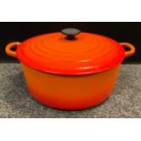 Le Creuset - a Cast Iron 'Volcanic' casserole lidded pot, 28cm