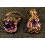 A pale purple amethyst pedant and similar dress ring, both 9ct gold mounts, Ring size Q, stamped 375