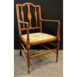 An Edwardian Sheraton Revival mahogany armchair, c.1905, 92cm high x 51.5cm wide.