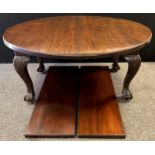A Victorian mahogany oval extending dining table, large carved cabriole legs, ball and claw feet,