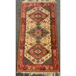 A Middle Eastern woollen rug, 188cm x 96cm.