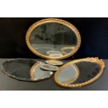 A gilt framed oval wall mirror; another; etc, (3).