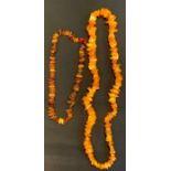 A Baltic amber bead necklace, another smaller, 73.3g gross (2)