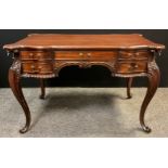A Louis XV style reproduction mahogany writing table, shaped top, arrangement of five drawers to