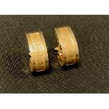 A pair of 18ct gold clip on earrings, stamped 750, 5.5g